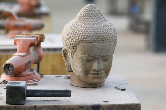 Artisans Angkor is a social business with the aim of providing employment for rural youth while preserving traditional Khmer craftsmanship. Stone carving. Siem Reap. Cambodia.