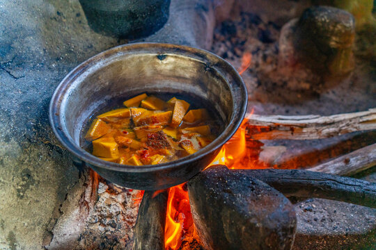 View of visitors and traditional curry dishes at Hiriwadunna Village, Anuradhapura, Sri Lanka