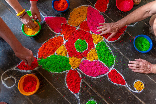 View of tourists taking part in traditional Hindu drawing art of Kolam, Nuwara Eliya, Kandy, Central Province, Sri Lanka