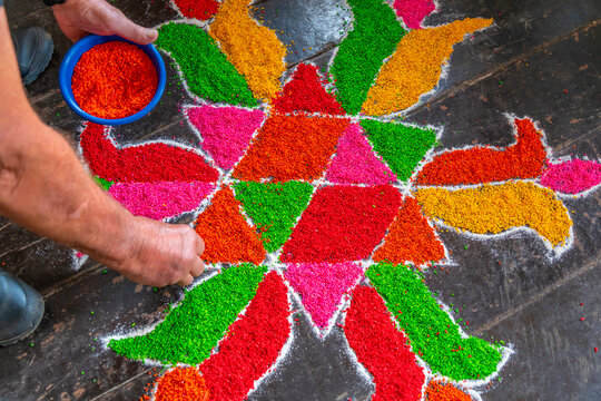 View of tourists taking part in traditional Hindu drawing art of Kolam, Nuwara Eliya, Kandy, Central Province, Sri Lanka