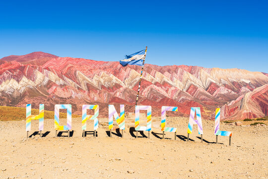 Viewpoint with flag at Serrania de Hornocal colorful mountains, Humahuaca, Jujuy, Argentina