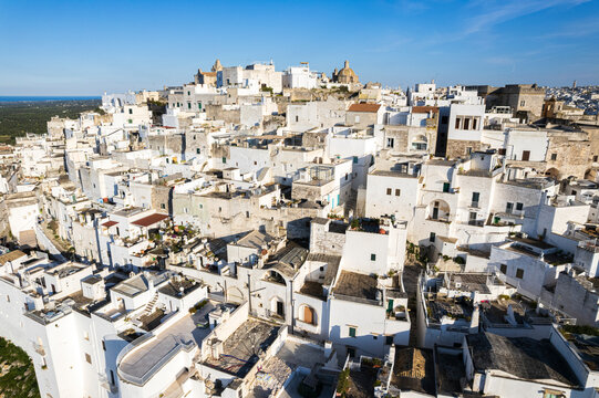 Aerial view of the white village of Ostuni built on top of a hill, the so called 'white city' of Apulia region, Brindisi province, Apulia region, South of Italy, Italy