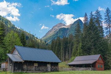 Travel to village in valley with cozy houses. Landscape and mountain rural scenery. Travel destination. Rural village houses. Landscape with mountain village in scenic nature © be free
