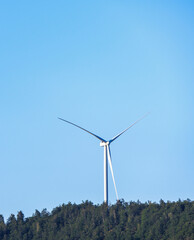 wind turbine on a blue sky © SporisevicPhotos