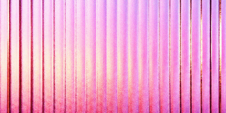 A vibrant, textured background featuring vertical, parallel corrugated metal ridges in a bright, saturated pink and purple gradient color scheme