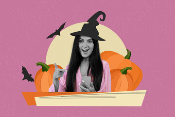 Fototapeta premium Smiling Young Woman With Long Dark Hair Wearing Witch Hat Holding Smartphone, Pointing At Screen In Celebration Of Halloween, October Festivities In Vibrant Purple Background. Fun Concept.