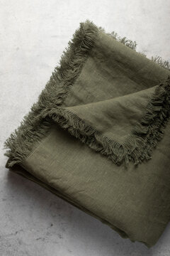 Folded Olive Green Fringed Linen Tablecloth Flat La