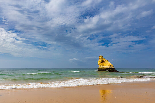 Picturesque beach Praia dos Tr&ecirc;s Castelos, with limestone cliffs, in the town of Portim&atilde;o, Algarve region, Faro District, Portugal - background or wallpaper