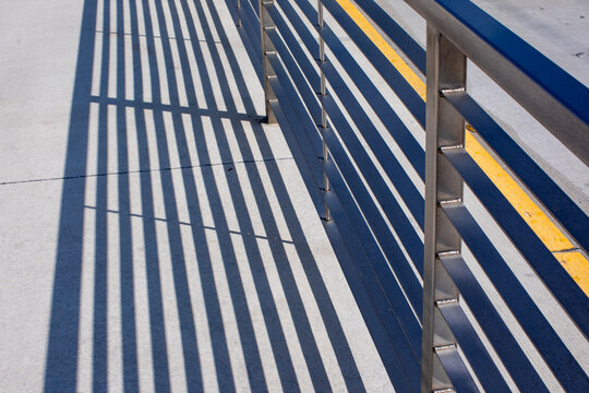 Geometric shadows from a metal railing