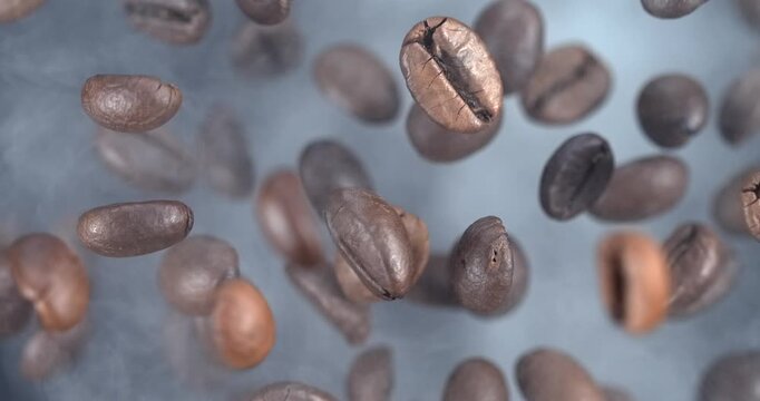 Roasted coffee beans falling in smoke in slow motion 1000 fps