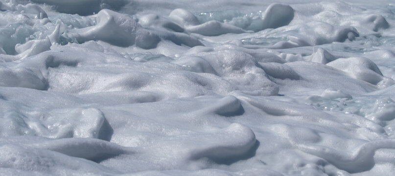 Thick White Sea Foam Forming Soft Abstract Shapes and Textures