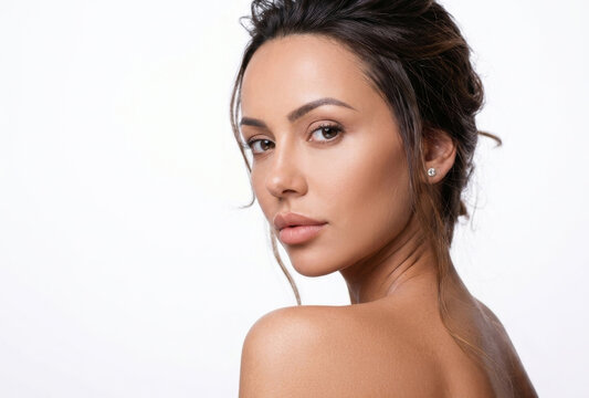 Close-up beauty portrait of a gorgeous young woman with natural makeup looking over her shoulder[cite: 8].