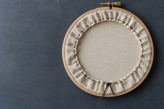 Gathered Fabric and Running Stitches on the Back of a Wooden Embroidery Hoop