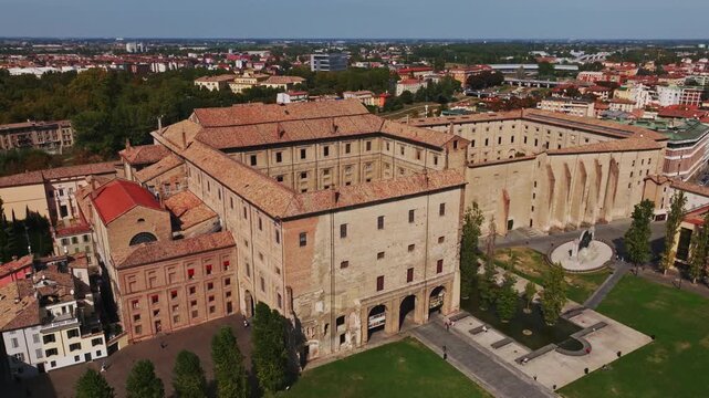 Aerial drone view of Palazzo della Pilotta in Parma, Italy, showcasing the monumental historic complex, grand courtyards, Italian architecture, and surrounding old town cityscape.