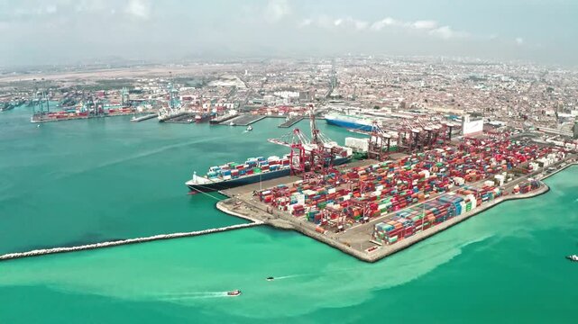 Aerial view of Puerto del Callao with cargo ships and shipping containers at the port in Callao, Region Callao, Peru.