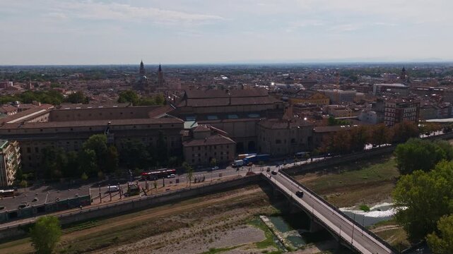 Aerial drone view of Palazzo della Pilotta in Parma, Italy, showcasing the monumental historic complex, grand courtyards, Italian architecture, and surrounding old town cityscape.