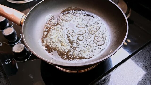 Person making french toast in a pan for breakfast
