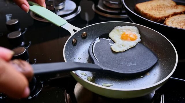 Frying a delicious quail egg in a pan for breakfast
