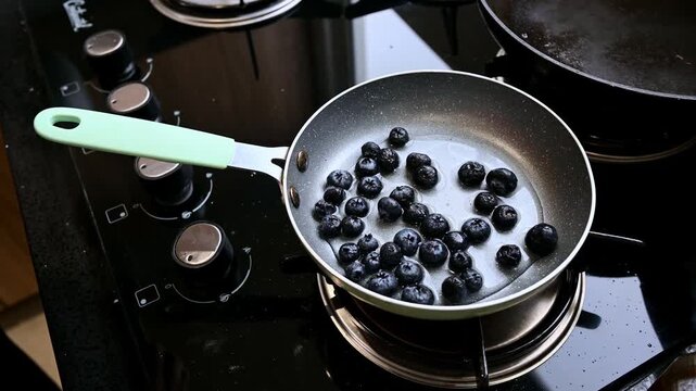 Chef cooking fresh blueberry with chia seeds for homemade jam