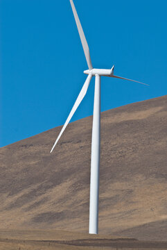 View of a white wind turbine on the dry slopes of Grouse Mountain in North Vancouver, British Columbia, Canada.
