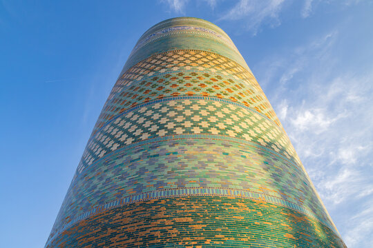 The Kalta Minor minaret in Khiva, Uzbekistan. This beautiful structure is the only minaret covered in colored tiles