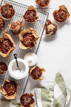 Several morning glory muffins on a cooling rack with copy space.