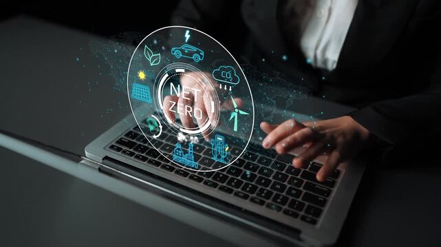Professional Business Person Engaging with Digital Net Zero Concept on Laptop Screen Focused on Sustainable Future and Renewable Energy Initiatives. Entropy.