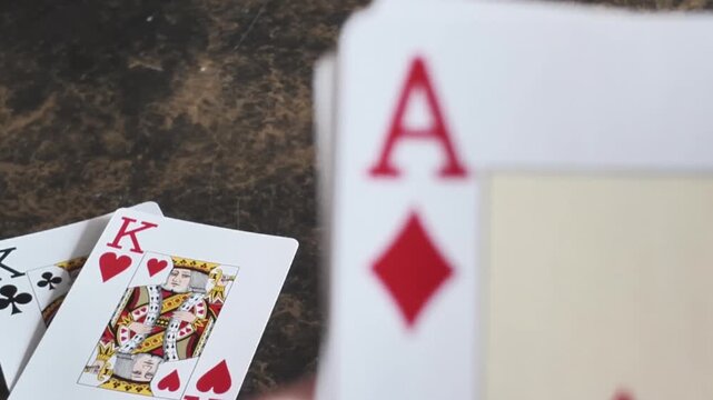 Close macro view of ace and king playing cards with selective focus and shallow depth of field.