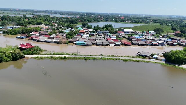 October 9, 2026, Sena District, Ayutthaya. Rainwater flowing from the north and heavy rainfall caused small rivers to overflow, flooding riverside homes in rural areas of Ayutthaya, Thailand.