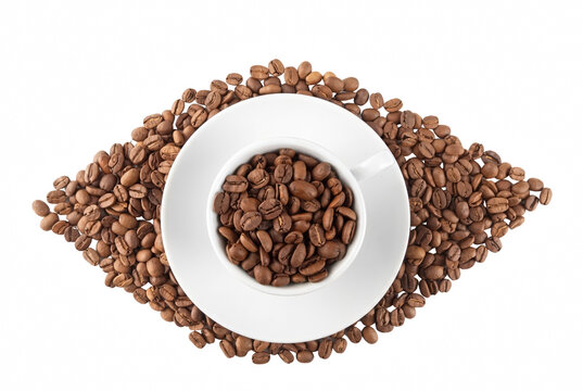 Roasted coffee beans filling a white cup and saucer arranged in a stylized eye shape
