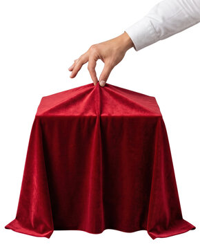 Hand Lifting Red Velvet Cloth to Reveal Hidden Object