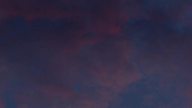 Dramatic Orange and Blue Sunset Clouds Filling the Sky, Vivid Vertical Cloudscape Texture Background