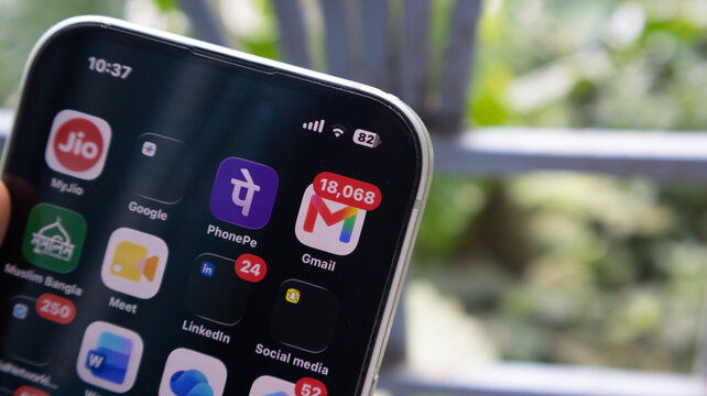 Smartphone screen interface displaying diverse mobile applications against blurred background and modern technology.