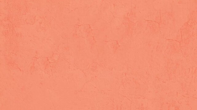 Abstract textured peach colored wall surface with cracks and subtle imperfections