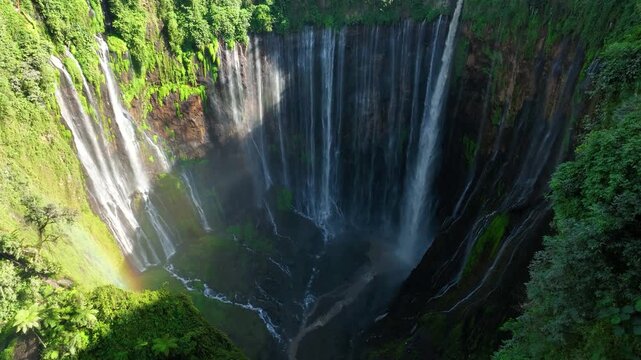 Tumpak Sewu Waterfall massive horseshoe shaped curtain of water in East Java, Indonesia