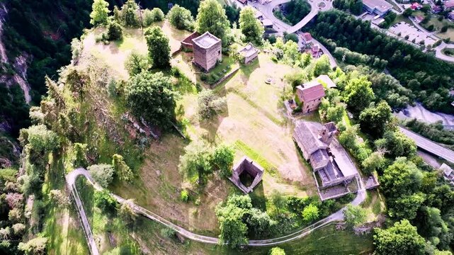 Aerial drone view of historic Hohen R&auml;tien Castle near Thusis, perched high above the valley and surrounded by forests and dramatic mountain scenery in Graub&uuml;nden, Switzerland.