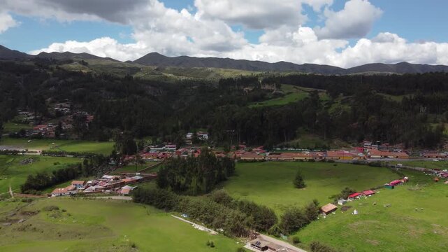 Aerial view of the cristo blanco statue with the beautiful peruvian landscape of cusco in the