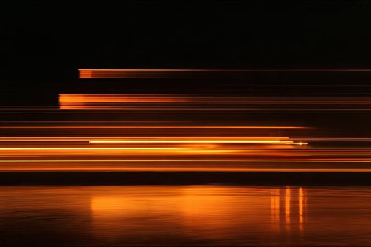 Streaks of warm orange light streak across a dark background, reflecting on water
