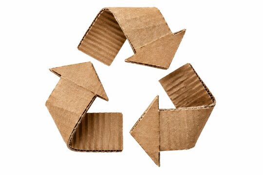 Handmade recycling symbol from folded brown corrugated cardboard isolated on white for sustainable packaging waste reduction reuse and environmental conservation