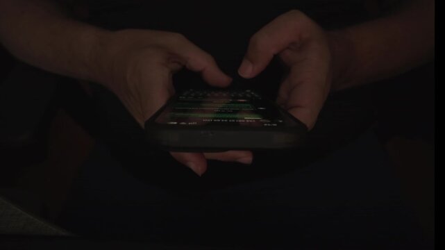 Detailed view of hands operating a modern smartphone screen while tapping and scrolling through digital content, demonstrating mobile connectivity, social media browsing, and online communication.
