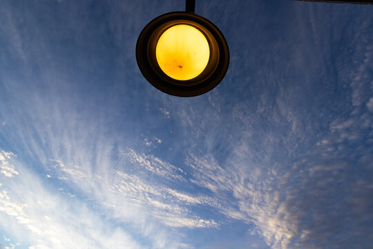 graphic image of overhead front door lamp and sunrise clouds