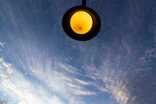 graphic image of overhead front door lamp and sunrise clouds