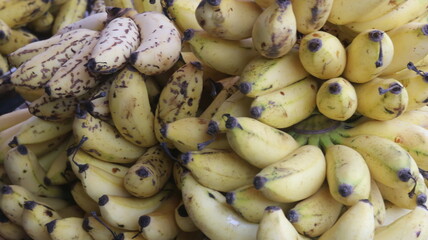 Fresh Ripe Yellow Bananas with Natural Brown Spots, Close-Up Tropical Fruit Background  © Fresh Foods
