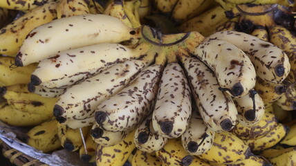 Fresh Ripe Yellow Bananas with Natural Brown Spots, Close-Up Tropical Fruit Background  © Fresh Foods