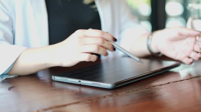 Close Up of Businesswoman Working with Stylus and Tablet