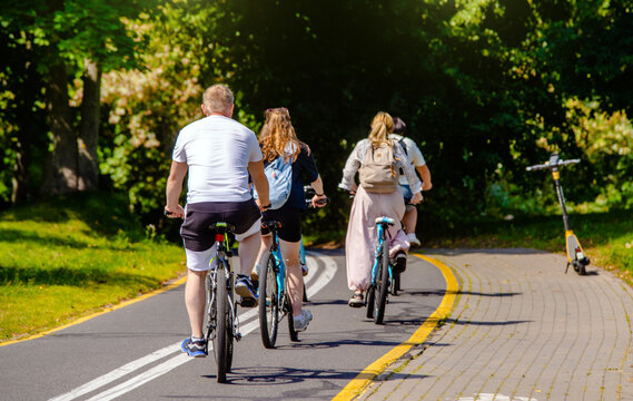 Cyclists ride on the bike path in the city Park
