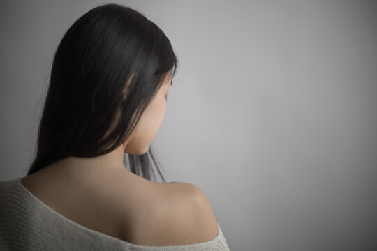 Southeast Asian woman with long black hair
