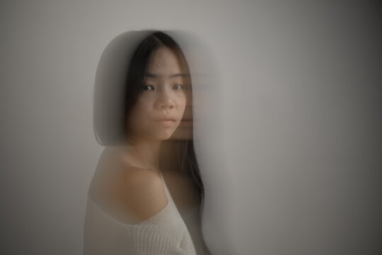 Portrait of young asian Southeast Asian woman with motion blur effect