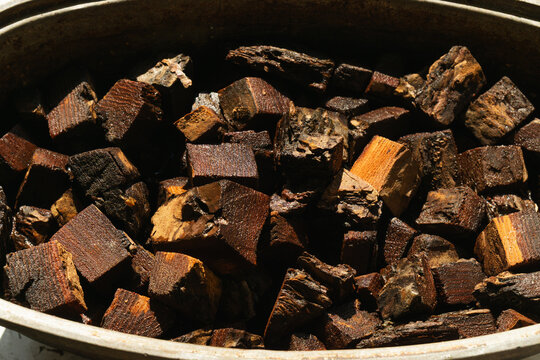 Wood pieces stored in a large container for future use in cooking or heating