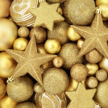 Christmas luxury gold star and ball shape bauble glittering decorations background design for the festive Xmas holiday season. Greeting card. 